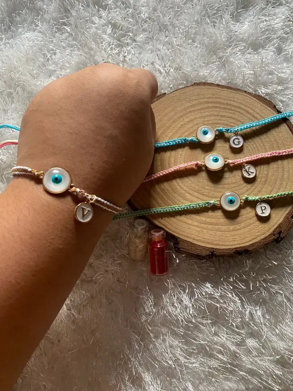 White evil eye Rakhi  With Alphabet