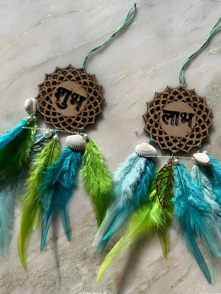 Shubh Labh Dreamcatcher Shubh Labh Dreamcatcher in shades of aqua with shells and pearls Aqua Shubh Labh Dreamcatcher for Diwali gifting. Shubh Labh Dreamcatcher( shades of aqua)