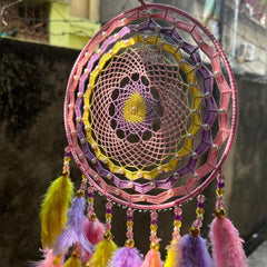 Blushing Sunrise Dreamcatcher in pink, lilac, and yellow Handcrafted Blushing Sunrise Dreamcatcher with white pearls Elegant Blushing Sunrise Dreamcatcher for home décor