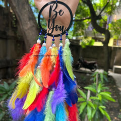 Be You Dreamcatcher with rainbow colors and white pearls Handcrafted Be You Dreamcatcher with vibrant shades Rainbow-themed Be You Dreamcatcher for home décor