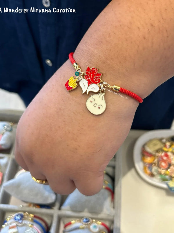 Red Adjustable Luxe Band featuring Fries, Ganesha and Modak charms.
